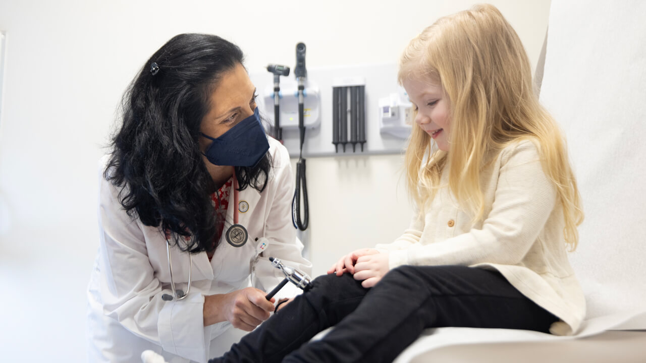 Doctor examining a child patient.