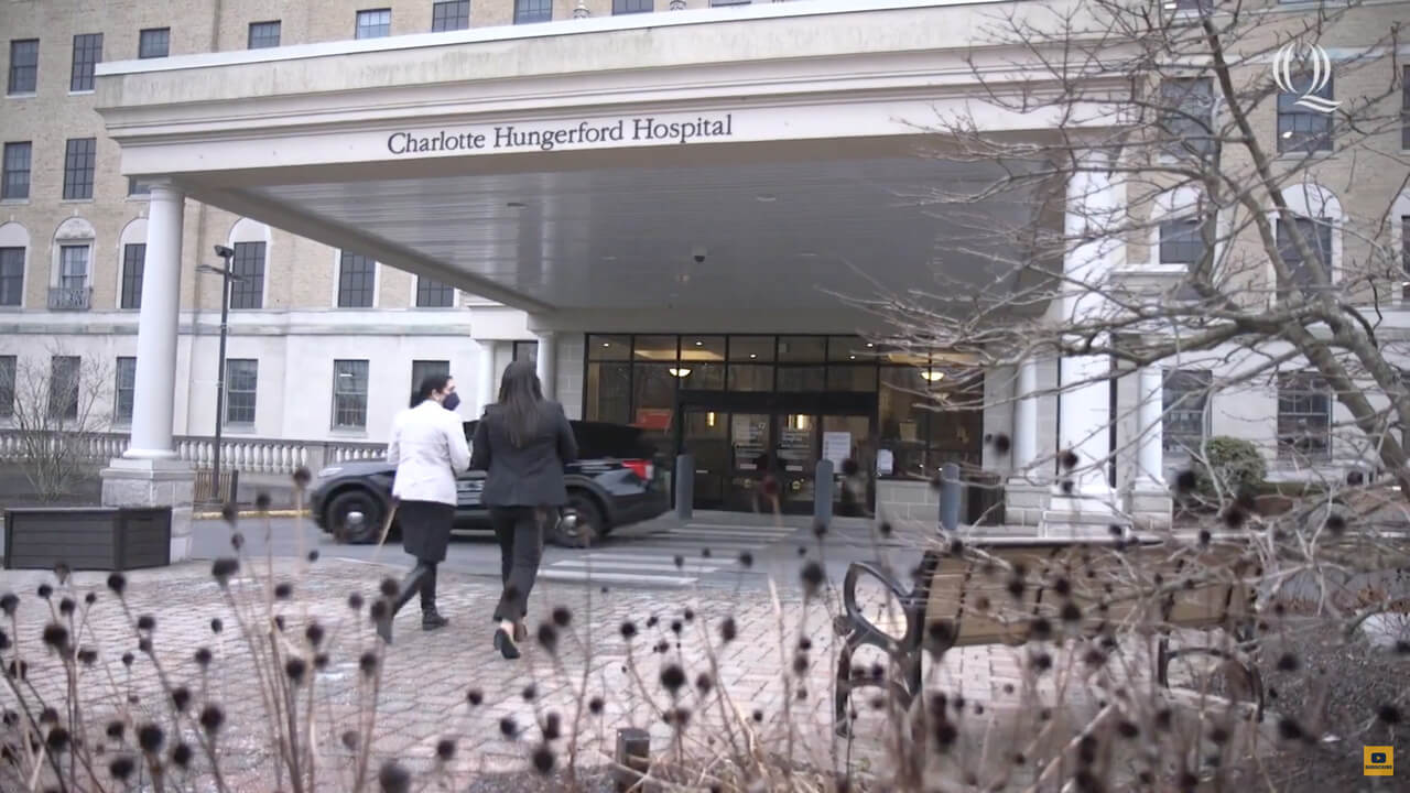 Outside of Charlotte Hungerford Hospital, plays video