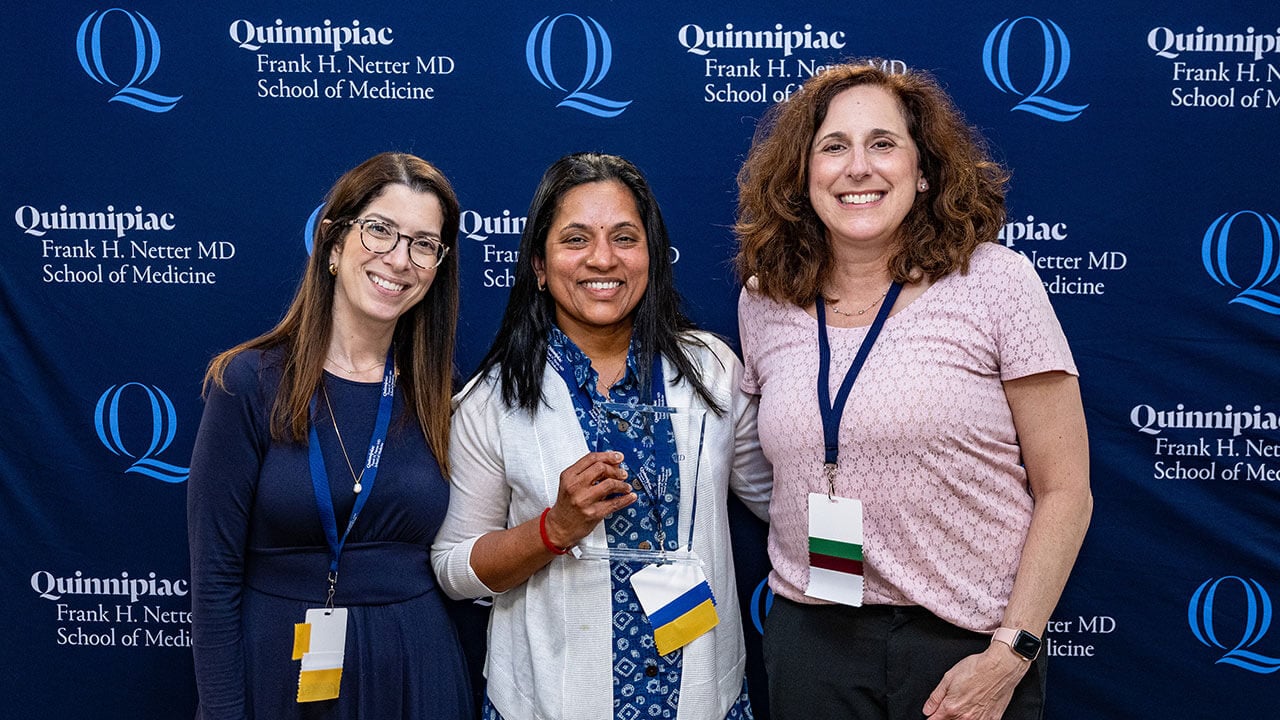 Lisa Coplit alongside SOM faculty at a faculty excellence event