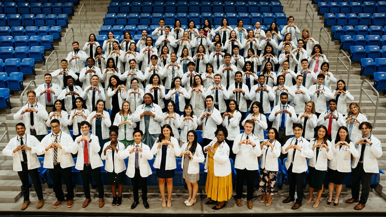 School of Medicine students pose for a class photo.