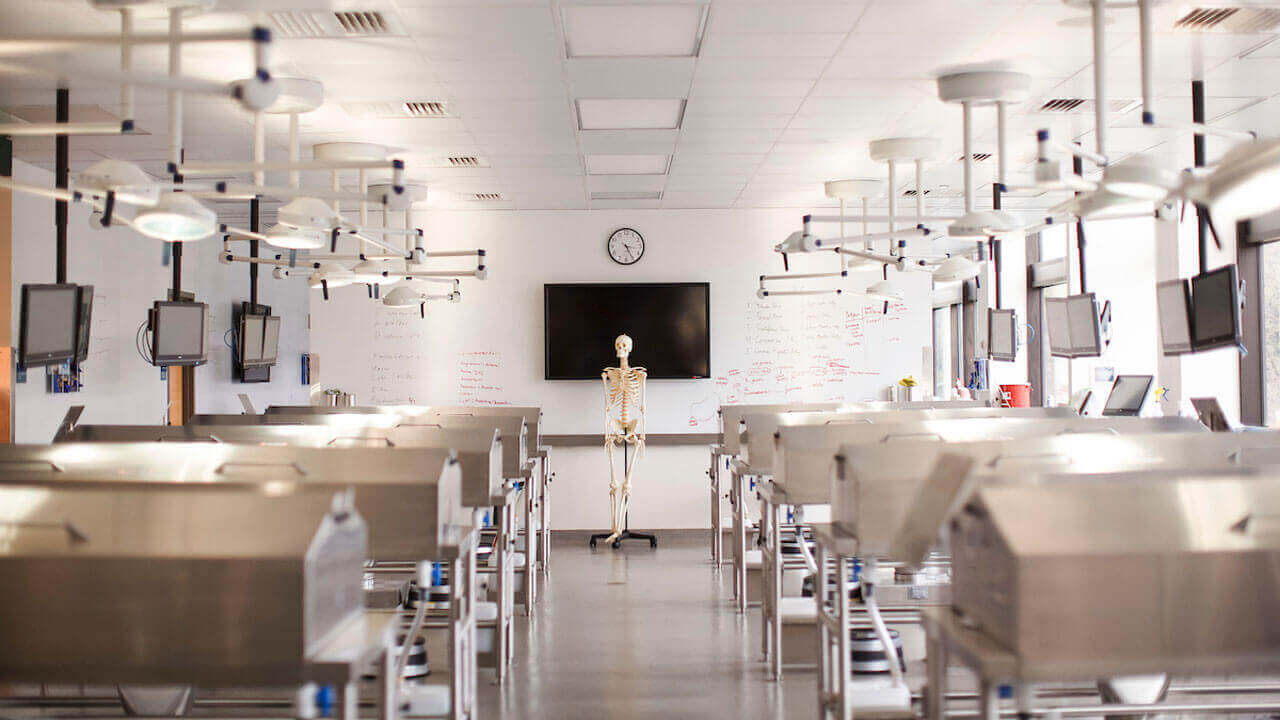 The empty Anatomy Lab with a skeleton at the front of the room.