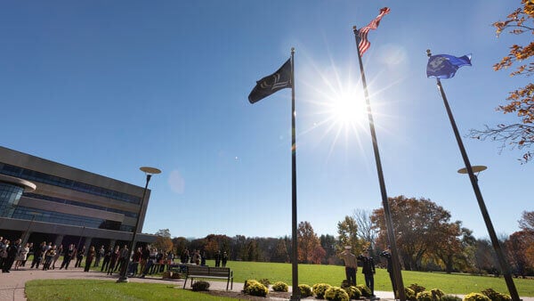 A veterans day ceremony outside the Center for Medicine, Nursing and Health Sciences